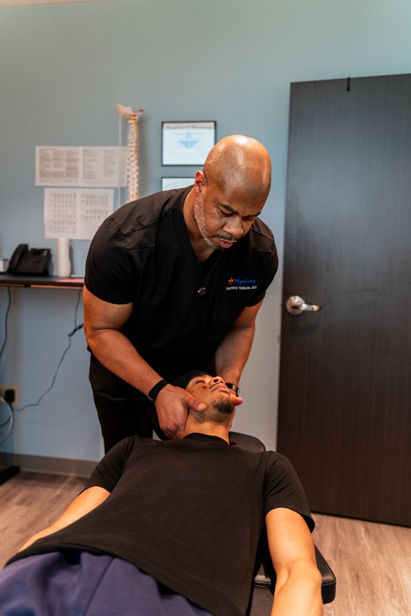 Cervical spine adjustment being performed for headache and neck pain relief