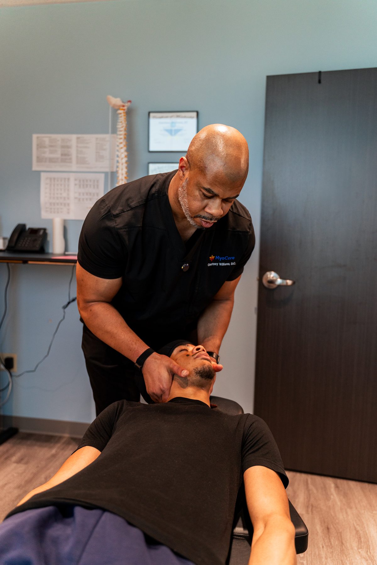 Cervical spine adjustment being performed for headache and neck pain relief