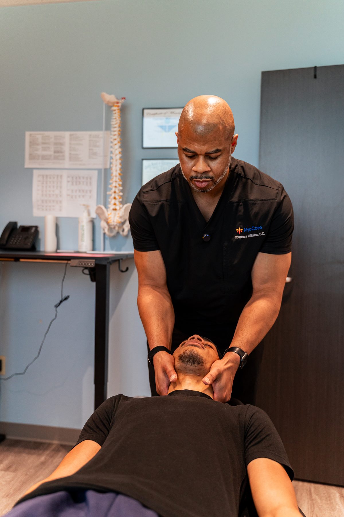 Patient receiving treatment at CJW Chiropractic Solutions in Las Colinas