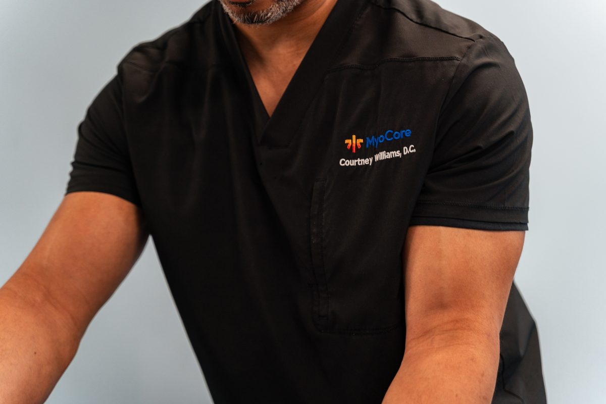 Dr. Williams demonstrating a hands-on technique with a patient