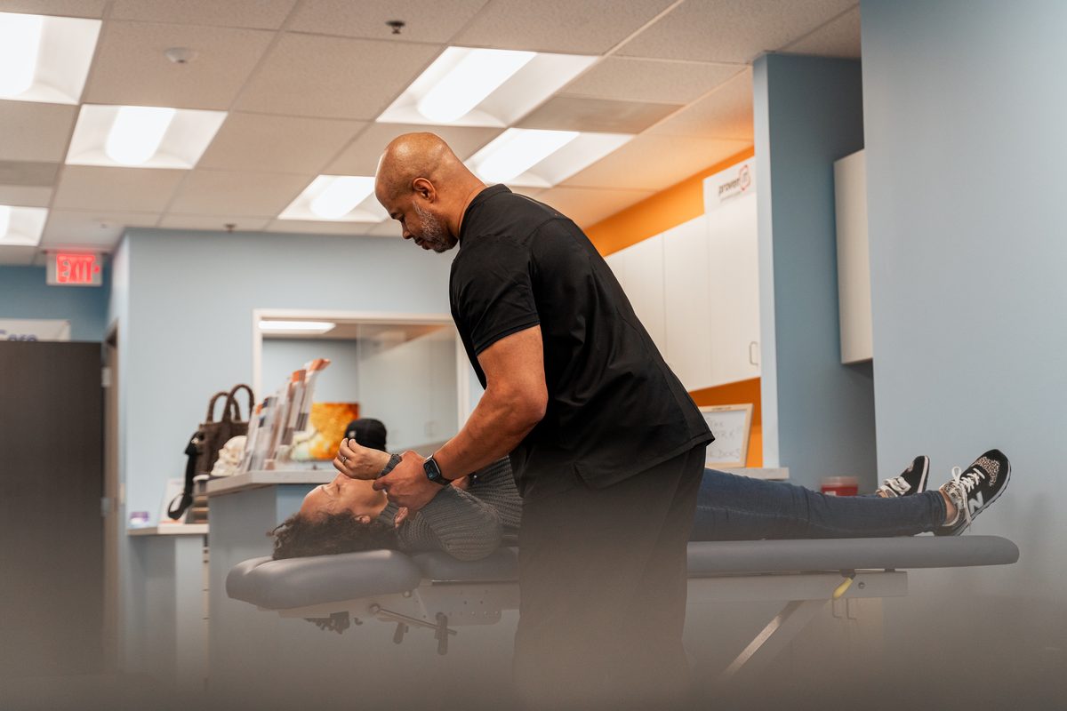 Close-up of patient lower back assessment by Dr. Williams