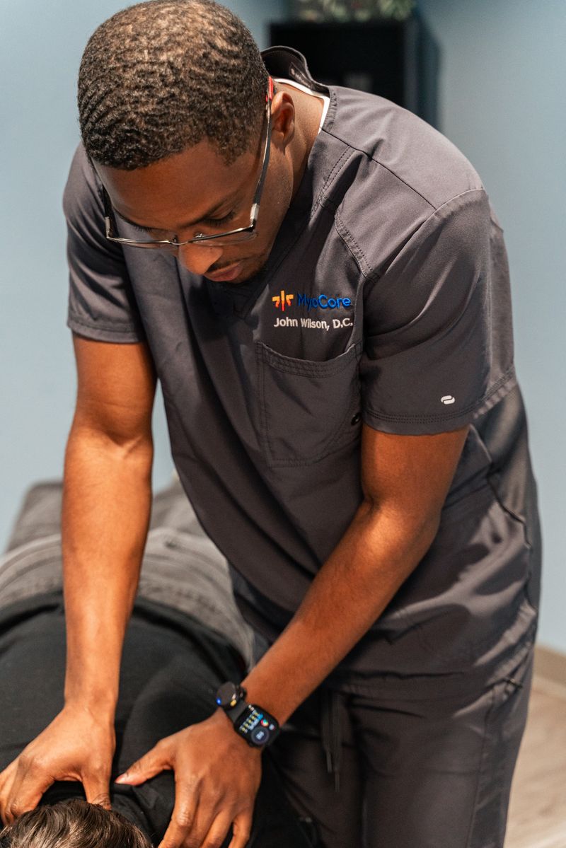 Dr. Wilson performing active release technique on a patient's leg